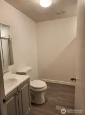 Downstairs bathroom with a shower.