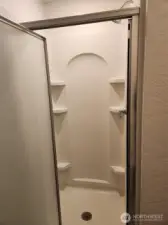 Downstairs bathroom with a shower.