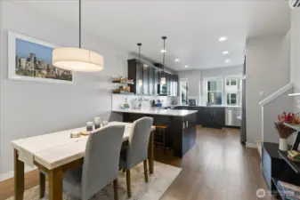 Dining area and the large chef's kitchen beyond.