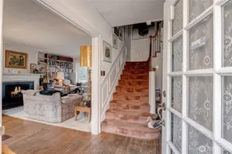 Entry with stairway leading to upper floor (3 bedrooms).  Original bathroom up with excellent expansion opportunity.