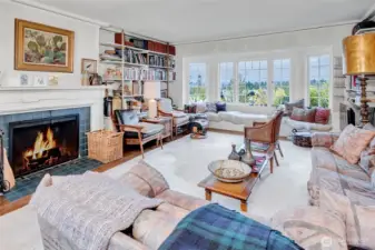 Lovely living room. Expanded window seating. Wood burning fireplace. Wonderful views of Lake WA & Cascade Mt. range to the East.
