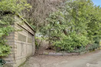 Lower alley 'old' 2-car garage leading up to back yard.
