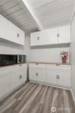 Large butlers panty with lots of extra cabinet space.