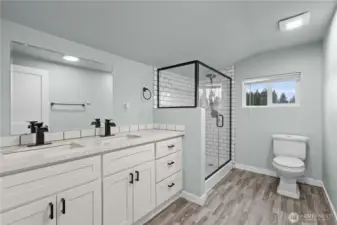 Upstairs bathroom with double vanity and walk in shower.