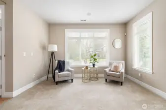 The front sitting room gets plenty of natural light, making it a bright and inviting space.