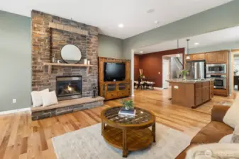 A stone-surrounded gas fireplace adds warmth and charm to the main living room.