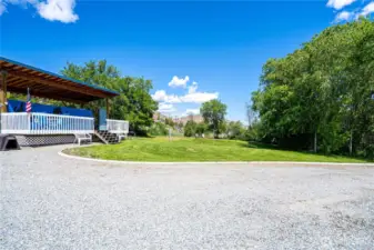 Level property with covered RV pad with a deck and River Views