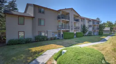 There is a long apron of grass and a sidewalk in between the 2 sets of buildings giving excellent separation and privacy.