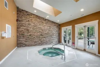 A wonderful interior hot tub protected from weather.