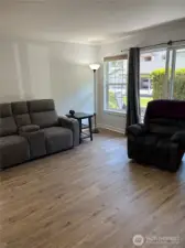 The home has beautiful white finished work with 6 panel doors, crown molding and white base board molding. Brand new vinyl plank flooring has been installed in the main living area and kitchen