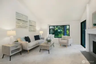 Large living room with vaulted ceiling and lots of natural light.