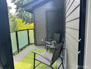 Patio overlooking the greenbelt area with a large storage closet.