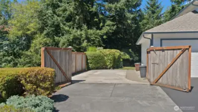 An even better look at the expansive paved parking area, offering ample space for all your extra vehicles and toys.