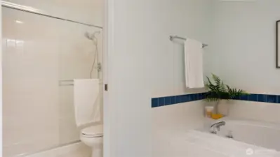 A full-size step-in shower adds both comfort and convenience to this five-piece primary ensuite.