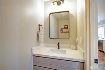 Powder room off the kitchen is perfect for when you are entertaining guests.