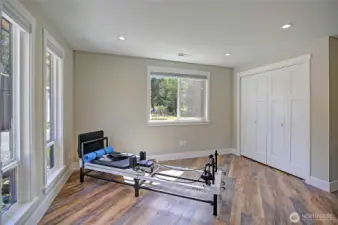 As you walk in, this bedroom is off to your left and could also be a den/office setup as well. The large windows make this space light filled.