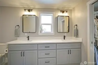 Double vanities and ample storage round out this amazing primary bathroom.