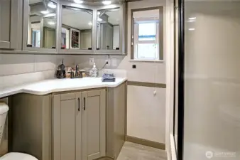 Full size 3/4 bath has everything and plenty of storage space.