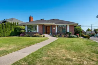 This remarkable mid-century gem sits proudly on a sunny corner lot and radiates charm, history, and thoughtful care at every turn.