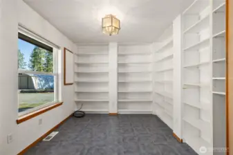 Office with tons of shelving.
