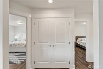 Laundry closet in  hallway between bedrooms