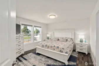 Primary room with west facing windows, lots of light