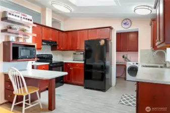 Bright, spacious kitchen with skylight.