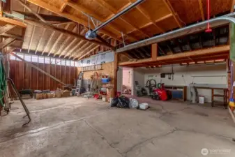 Interior of garage- bright and spacious with work bench and tons of storage!