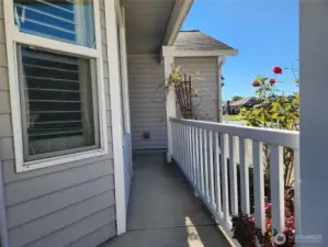 Cozy front porch, room for a small chair to enjoy your morning coffee!