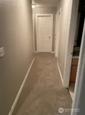 Hallway to bedrooms, guest bath, utility room/garage - new carpet installed 1/5/26