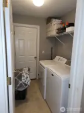 Down from the guest bathroom is the laundry room, which leads out to the garage.