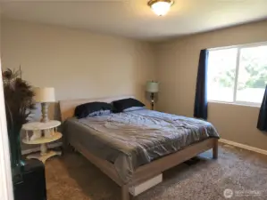 Primary bedroom, plenty of space for this king sized bed.