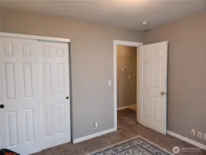 Closet & view of hallway to guest room 1