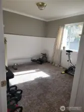 Guest room 2, currently being utilized as a workout room