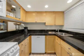 Remodeled kitchen with granite counters.