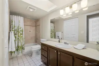 Remodeled bath with wonderful designer tile.