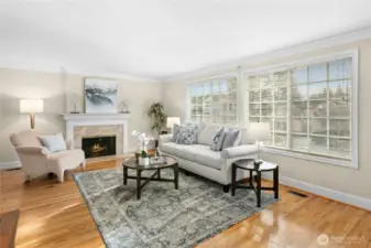 Beautiful hardwoods and big windows with lots of southern light draw you into the living room.