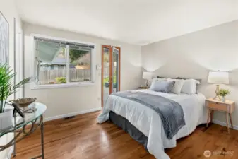 Your primary bedroom overlooks the back yard. The original hardwood floors add warmth throughout.
