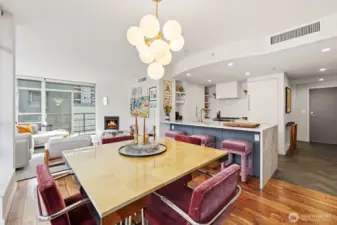 Welcome home.  This image is showing the kitchen, dining and living room.