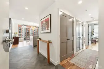 Entry with herringbone slate flooring & engineered hardwood flooring.