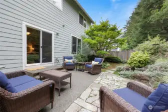 Outside, step into your garden oasis. Full patio for entertaining...