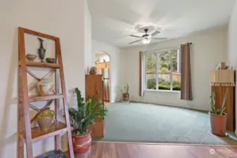 To the right, a dedicated dining room space off the kitchen (or makes for a cozy reading room and library).