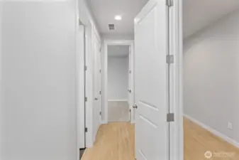 Multi-Gen hallway to Bedroom, Bath, & Stack Laundry Room