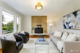 Living room with wood-burning fireplace.