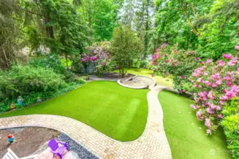 AstroTurf on first terrace, fully fenced backyard.