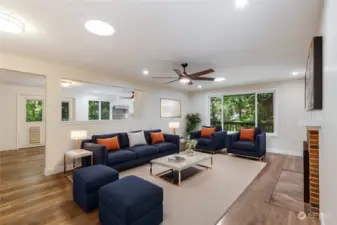 Enter into the large living room connected to the kitchen and dining space.