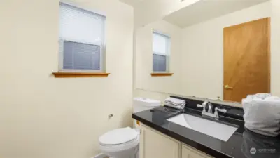 Powder room off the family room & across from the laundry