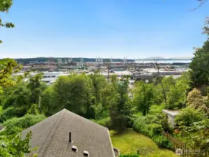 Take in sweeping views of the port, city, and mountains from your own backyard. This home offers a rare combination of privacy and perspective just minutes from the action.