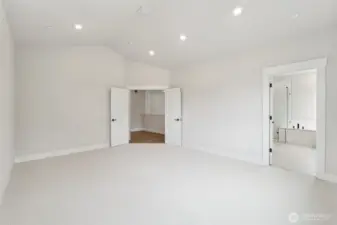 Primary bdrm.  Very spacous that ca fit large furniture.  Vaulted ceilings w/can lighting and prewired for ceiling fan or chandelier.