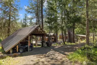 The Cook Shack has extra covered parking for your 4wheeler, BBQ & woodstove!